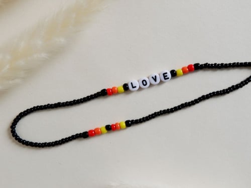 تعليقة زينة للجوال LOVE (برتقالي)