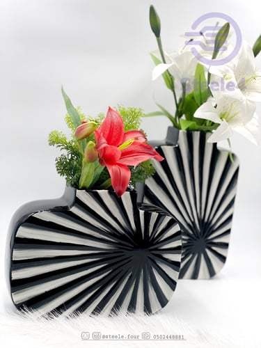 مزهريه بتصميم معاصر تتميز بدمج اللون الابيض والاسو...