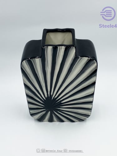 مزهريه بتصميم معاصر تتميز بدمج اللون الابيض والاسو...