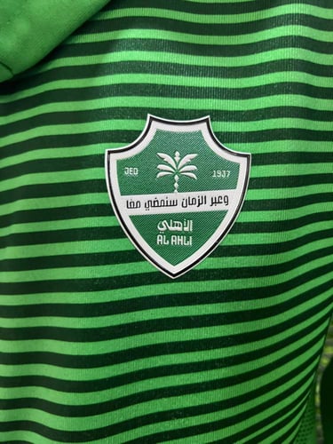 جاكيت الاهلي السعودي الشتوي الأخضر 2026