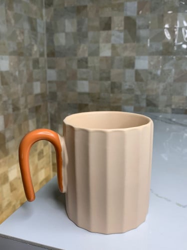 كوب سيراميك بمسكه برتقالي