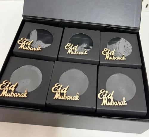 Eid distribution box with the phrase Eid Mubarak a...