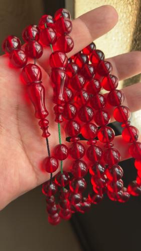 مسباح دائري شفاف لون حب الرمان