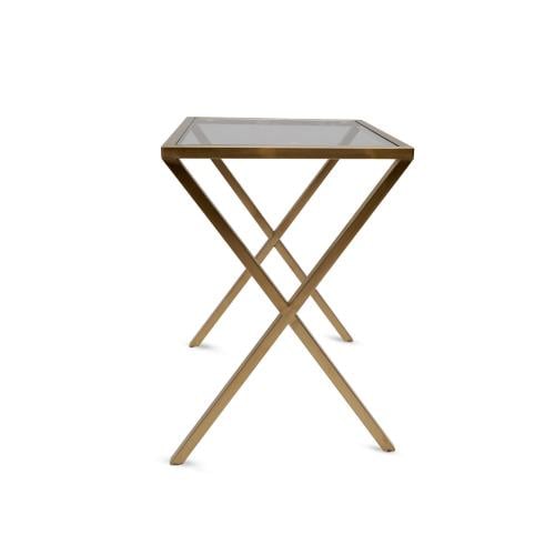 A modern gold side serving table with an elegant intersecting base