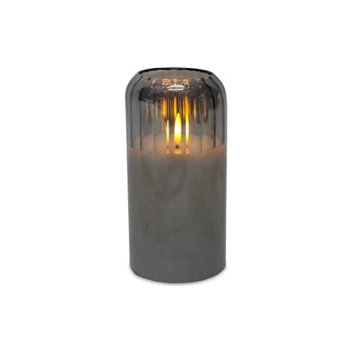 Electronic candle inside a gray glass container with a calm and modern touch