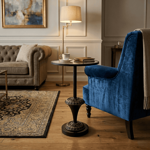 Luxury round serving table with glass surface and a black and gold decorated metal base