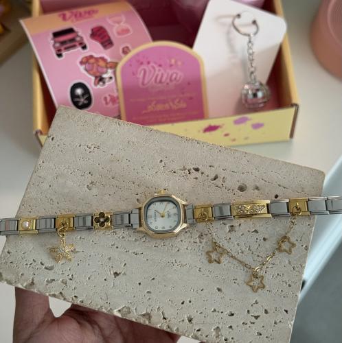 A watch in silver and red
