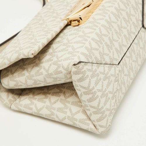 شنطه مايكل كورس حجم صغير كروس بدي لون كريمي سقنتشر