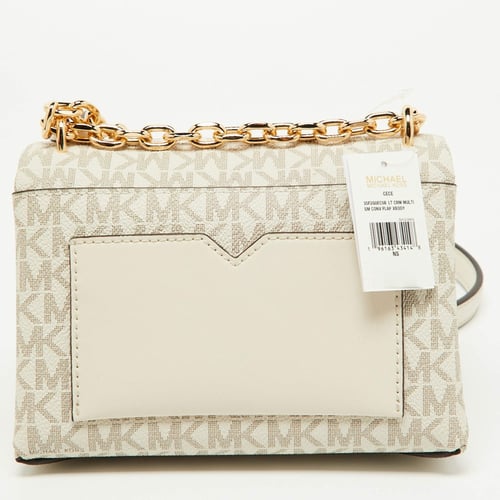 شنطه مايكل كورس حجم صغير كروس بدي لون كريمي سقنتشر