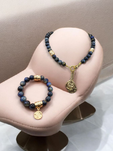 طقم مميز وراقي من حجر عين النمر الكحلي بلون جذاب ....