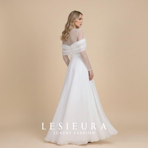 فستان سهرة ابيض طويل أنيق بأكمام لولو