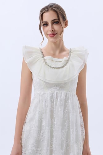 فستان تول مطرز مع ياقة كشكش