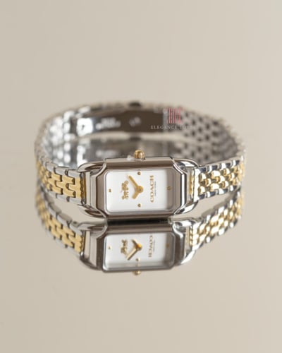 ساعة نسائية ماركة كوتش - ميناء مستطيل ذهبي + فضي