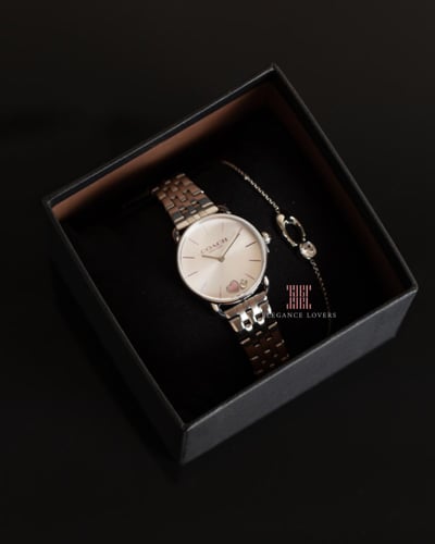 طقم نسائي ساعة + إسوارة ماركة كوتش - Silver & Pink...