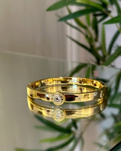 إسوارة كريستال مطلية ذهب ماركة كوتش