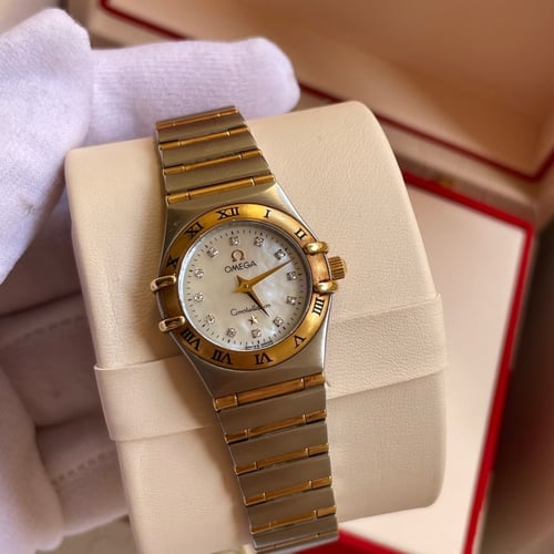 ساعة أوميغا نسائي ستيل وذهب مينا صدف الماس