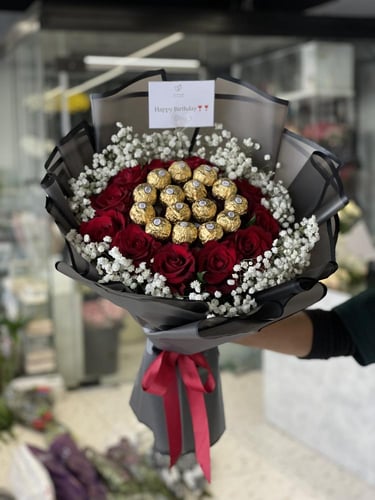 باقة ورد جوري أحمر فاخرة مع فيريرو روشيه - هدية من...