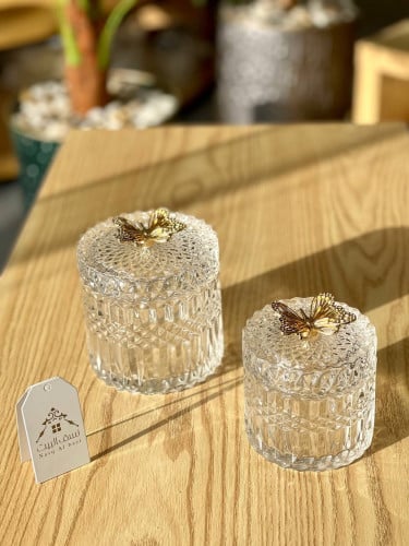 وعاء تقديم زجاجي مع مسكة فراشة ذهبية