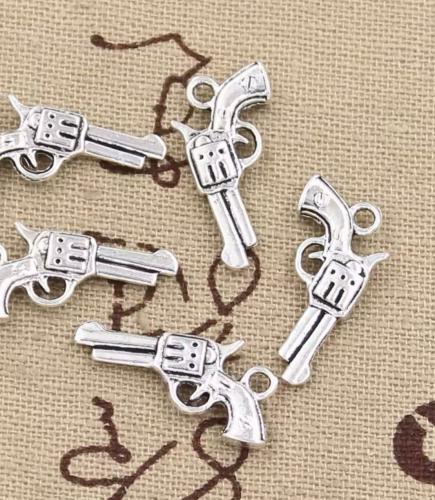 قطع معدنية شكل مسدس فضي 12 حبة