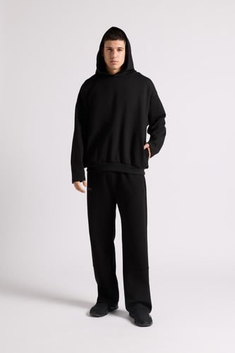 هودي بطباعة وقصة واسعة Acid Wash للجنسين أسود