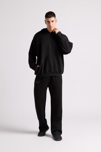 هودي بطباعة وقصة واسعة Acid Wash للجنسين أسود