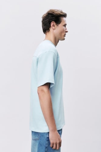 تيشيرت إنترلوك أزرق سماوي للجنسين