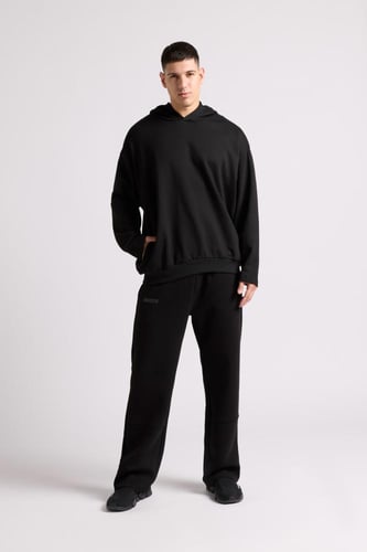 هودي بطباعة وقصة واسعة Acid Wash للجنسين أسود