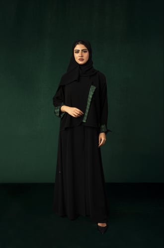 تطريز الهوية الوطنية باللون الاخضر