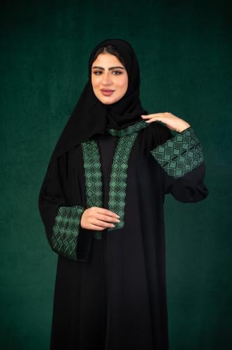 تطريز الهوية الوطنية باللون الاخضر