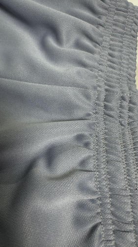 بنطلون رياضي للجنسين يحتوي على علامة نايك رمادي