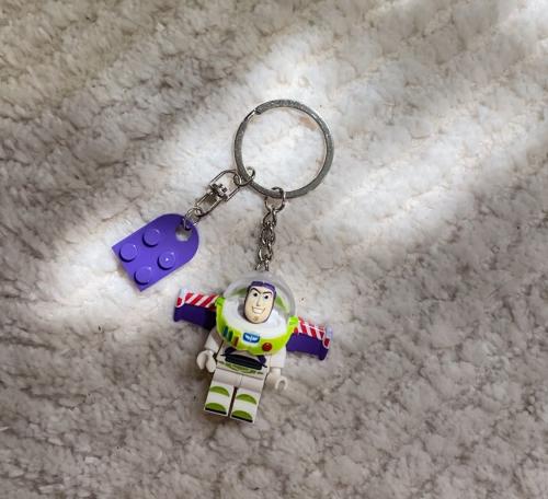 Buzz Lightyear Keychain with a Brick