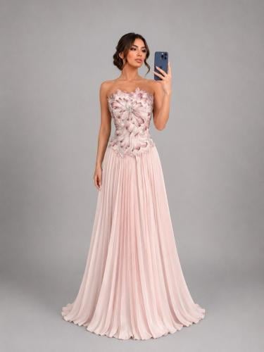The chest dress is embroidered with Russian Mikado, pleated, and flared.