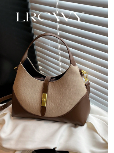 Women's handbag with an elegant shoulder strap