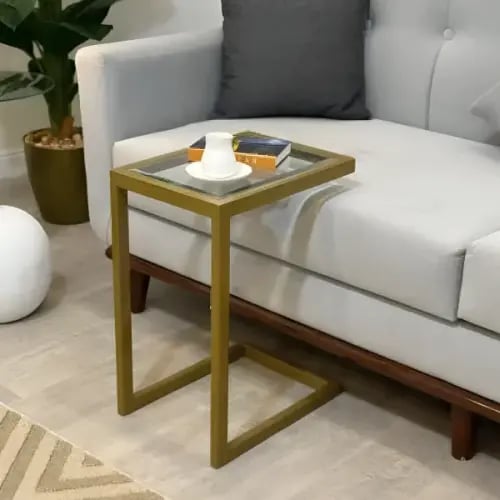 طاولة خدمة أنيقة معدنية باللون الذهبي– سطح زجاج شف...