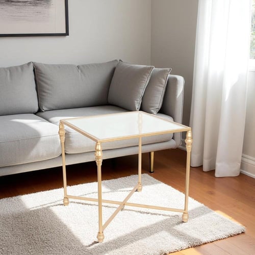 طاولة خدمة قواعد حديد لون ذهبي وسطح زجاج شفاف