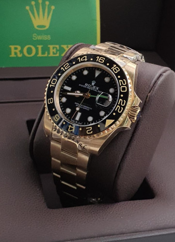 ساعة رولكس تصميم اسود و ذهبي رجالية