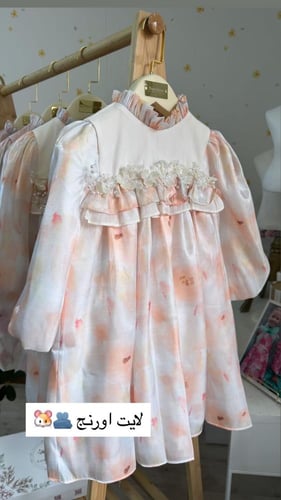 فستان راقي لايت اورنج بقماش كوري بشك عالصدر