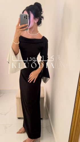 فستان اسود طويل وساتر