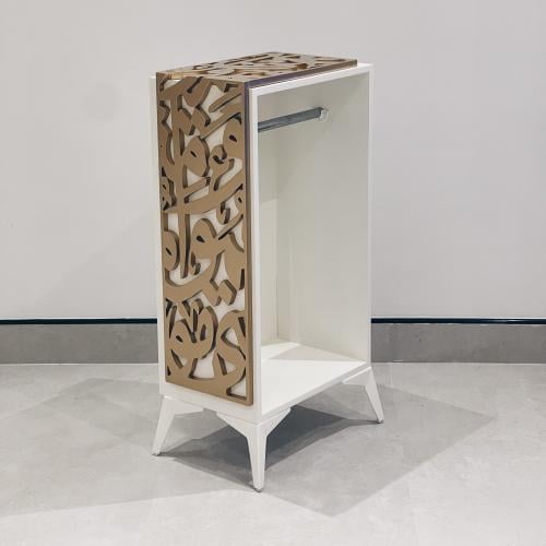 دولاب تنظيم سجادات بتصميم مميز حروف عربية