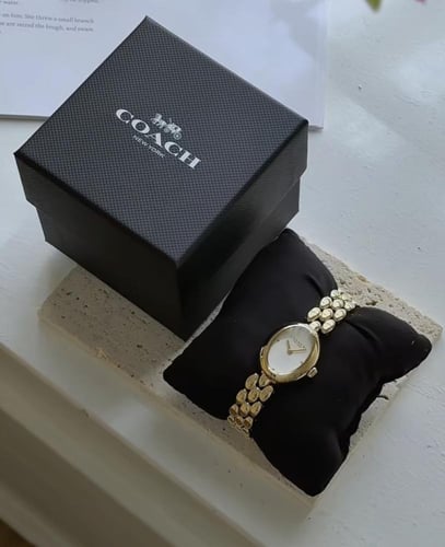 ساعه كوتش ذهبي