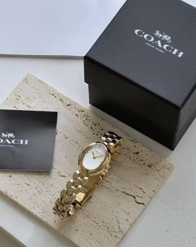 ساعه كوتش ذهبي