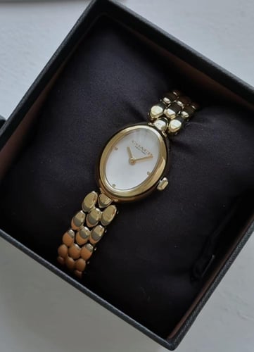 ساعه كوتش ذهبي