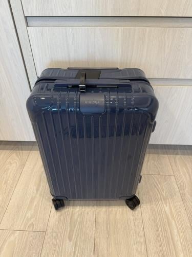 RIMOWA Essential Cabin suitcase in a glossy blue