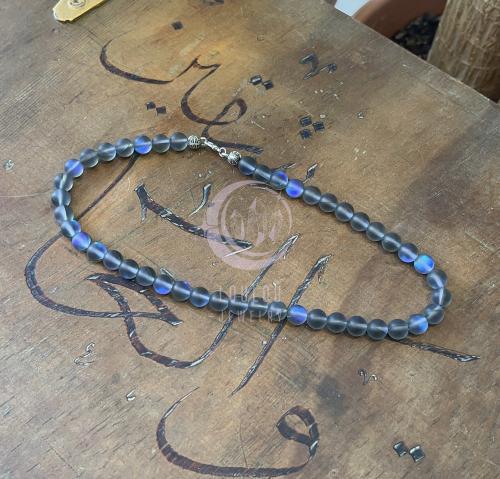 تعليقة غطاء جوال من حجر ضوء القمر باللون الرمادي