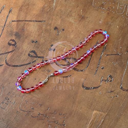 تعليقة غطاء الجوال من حجر ضوء القمر باللون الوردي