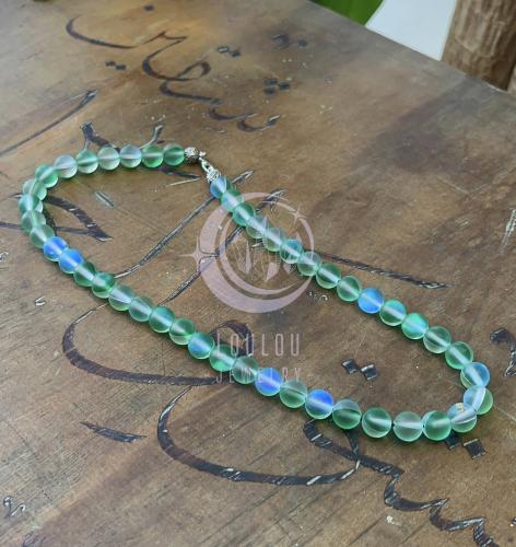 تعليقة غطاء الجوال من حجر ضوء القمر بلون الأخضر ال...