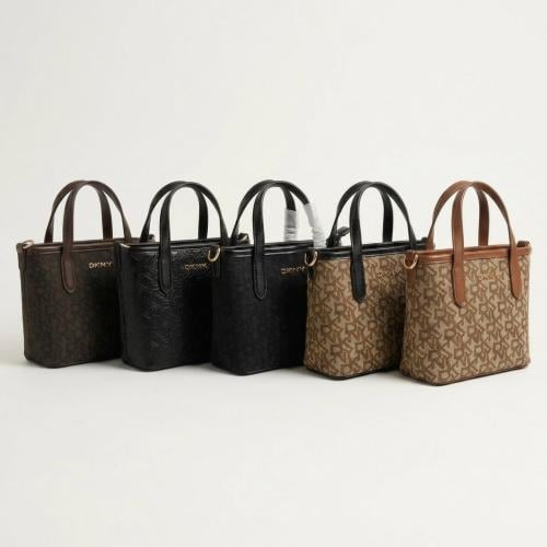 شنط يد من DKNY تصميم أنيق بلمسة عصرية . ماستر كوال...