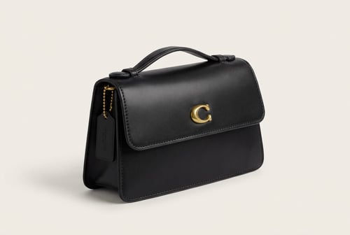 حقيبة كوتش يد أنيقة – تصميم كلاسيكي بلمسة عصرية ....