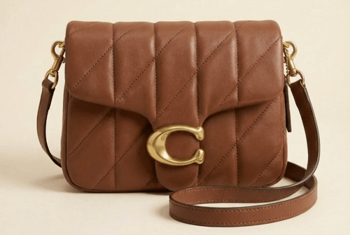 حقيبة يد تابي من كوتش COACH بتصميم مبطّن ولمسة كلا...