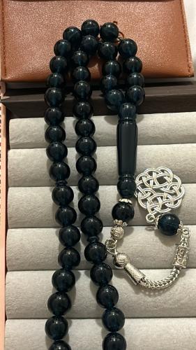 Dark transparent oily-colored prayer bead